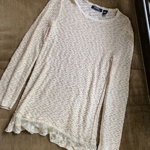 Long cream colored cotton sweater with lace trim on the bottom